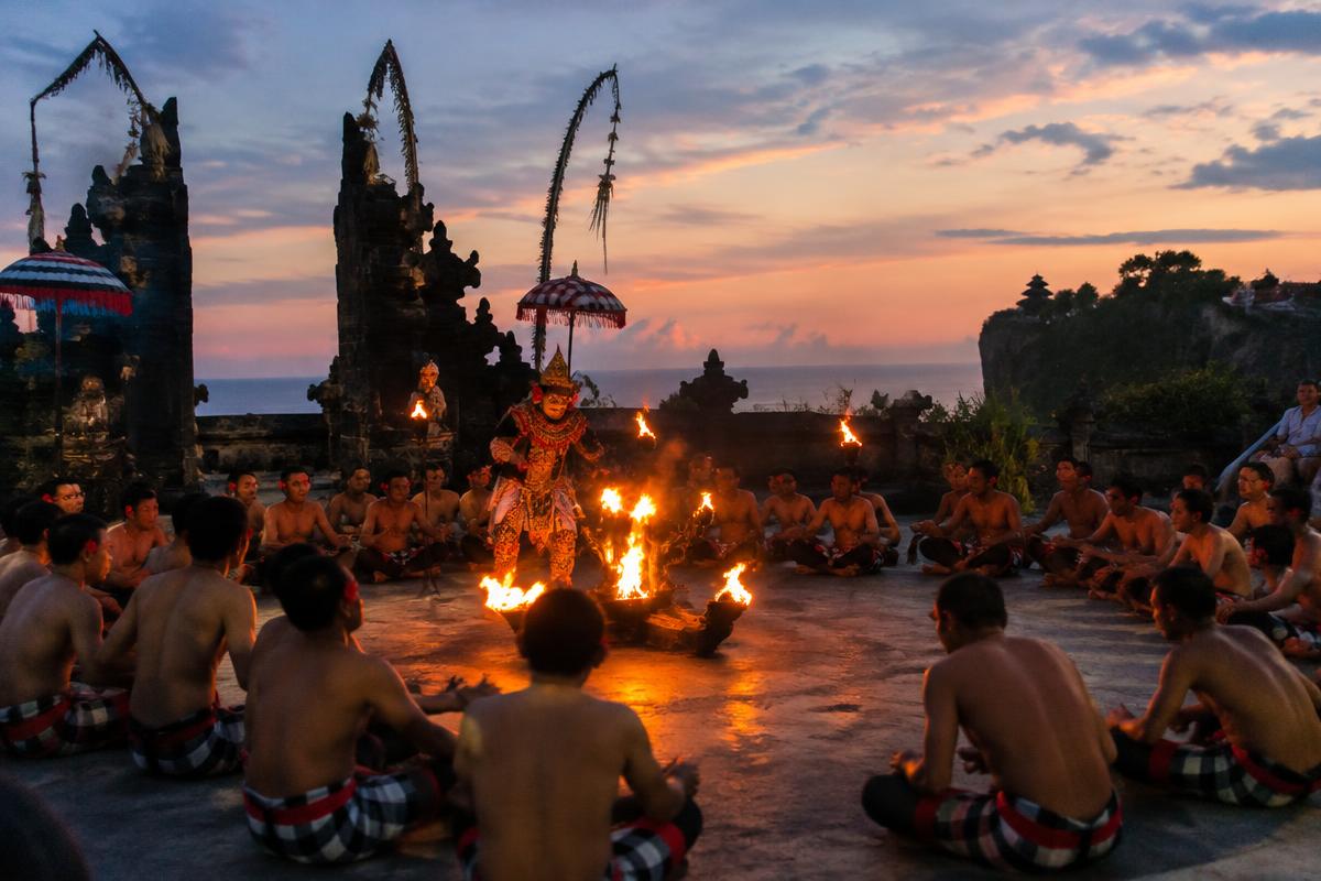 A traditional Balinese Kecak fire-dance performance at dusk